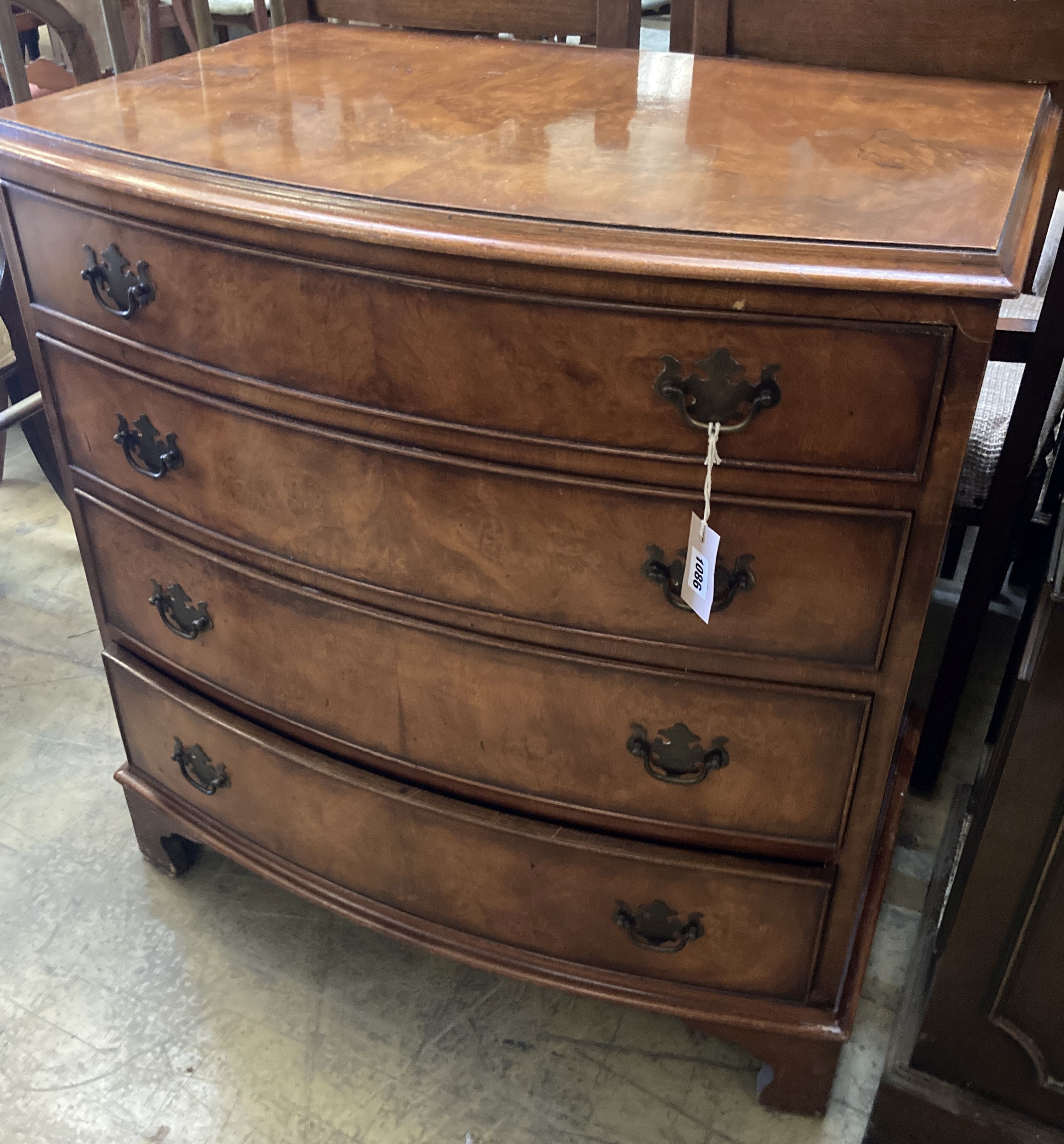 A George III style walnut bow front chest of drawers, width 80cm, depth 52cm, height 83cm